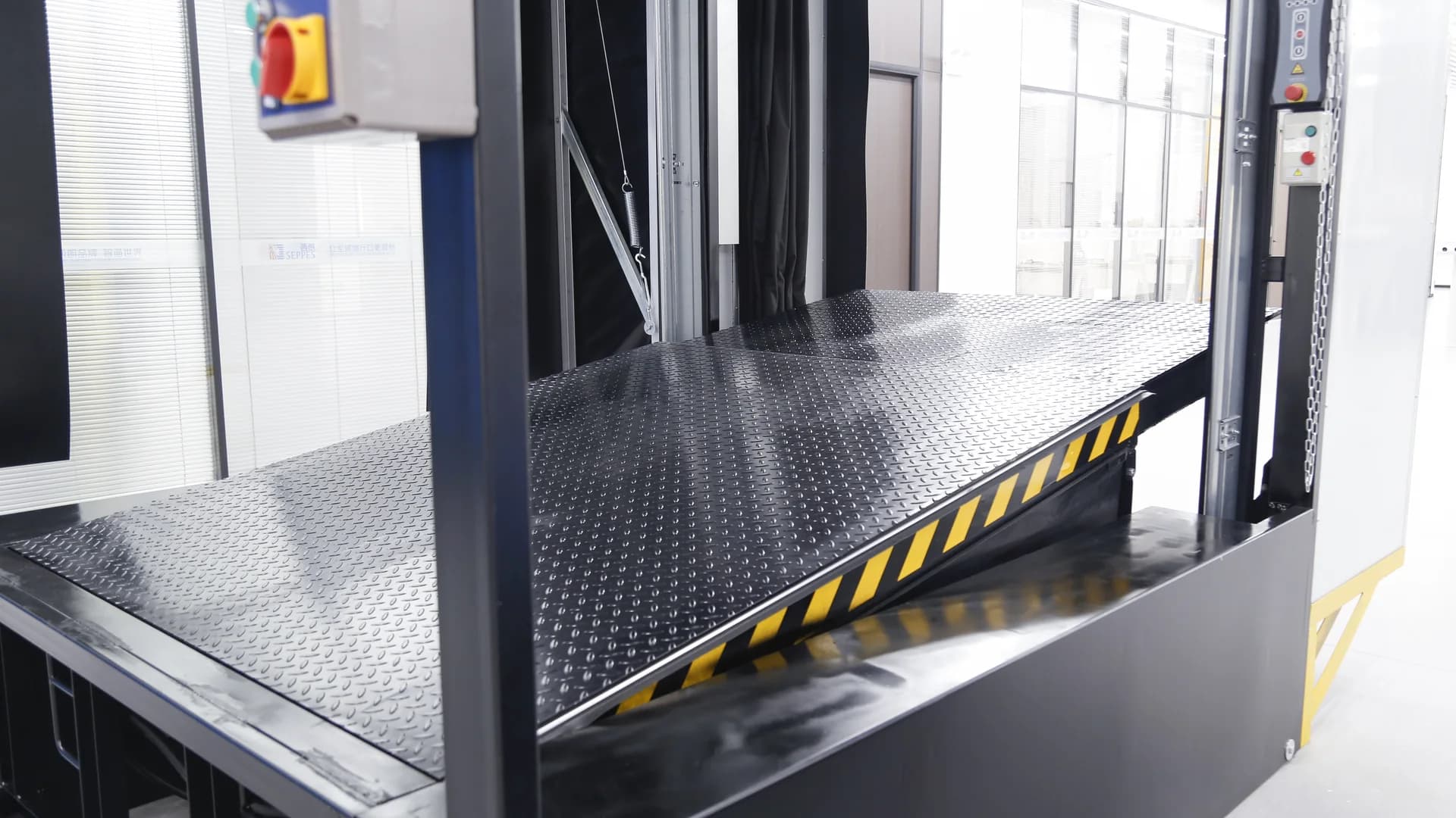 SEPPES hydraulic dock leveler raised for loading-bay inspection