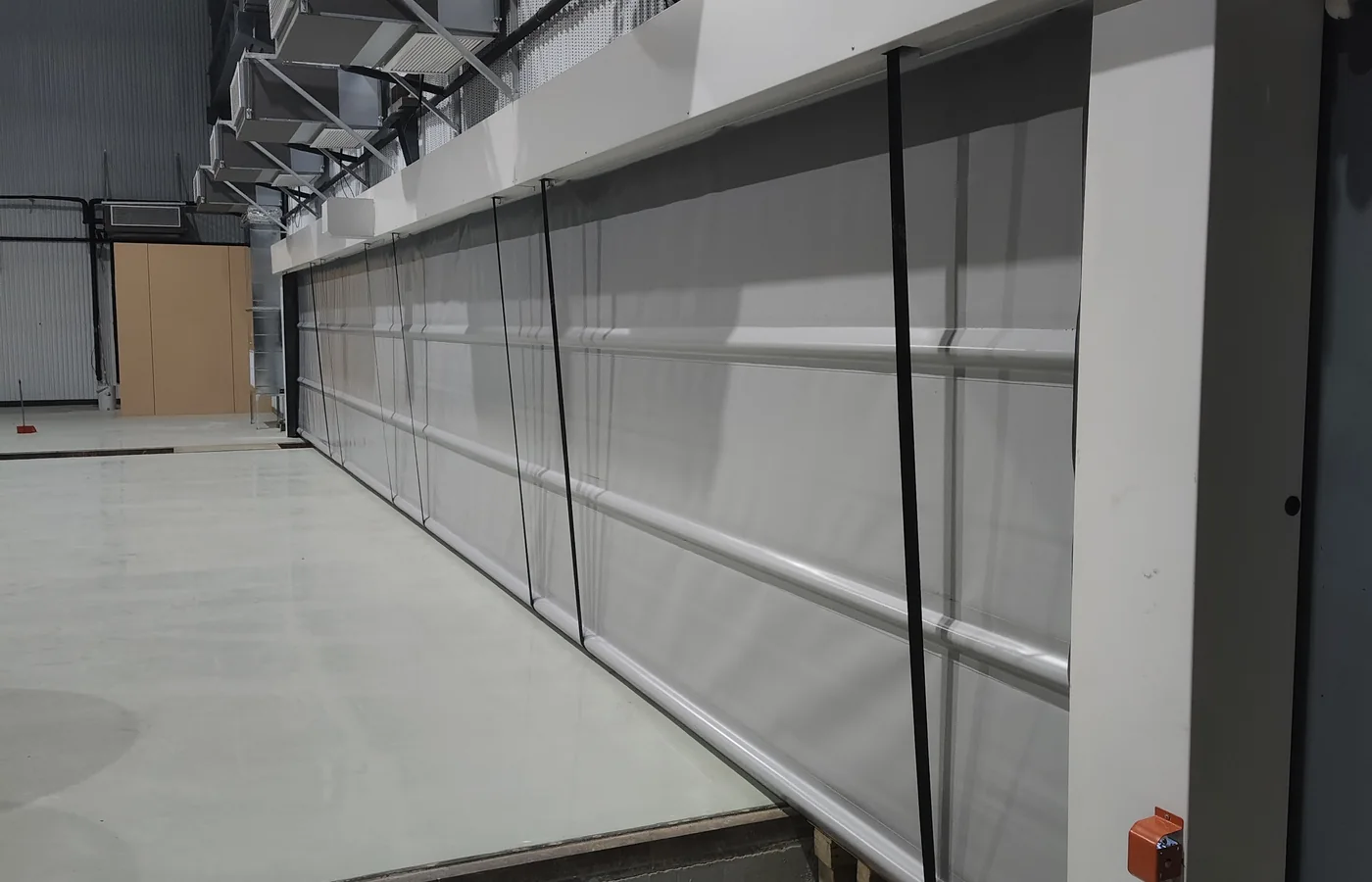 Reinforced fabric stacking door installed inside a factory