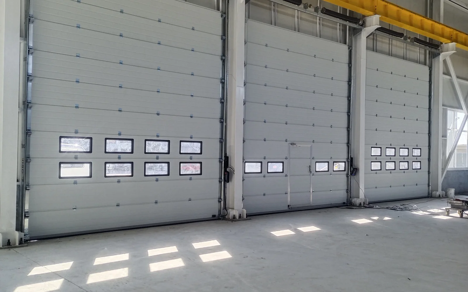 SEPPES industrial sectional doors installed at warehouse entrances